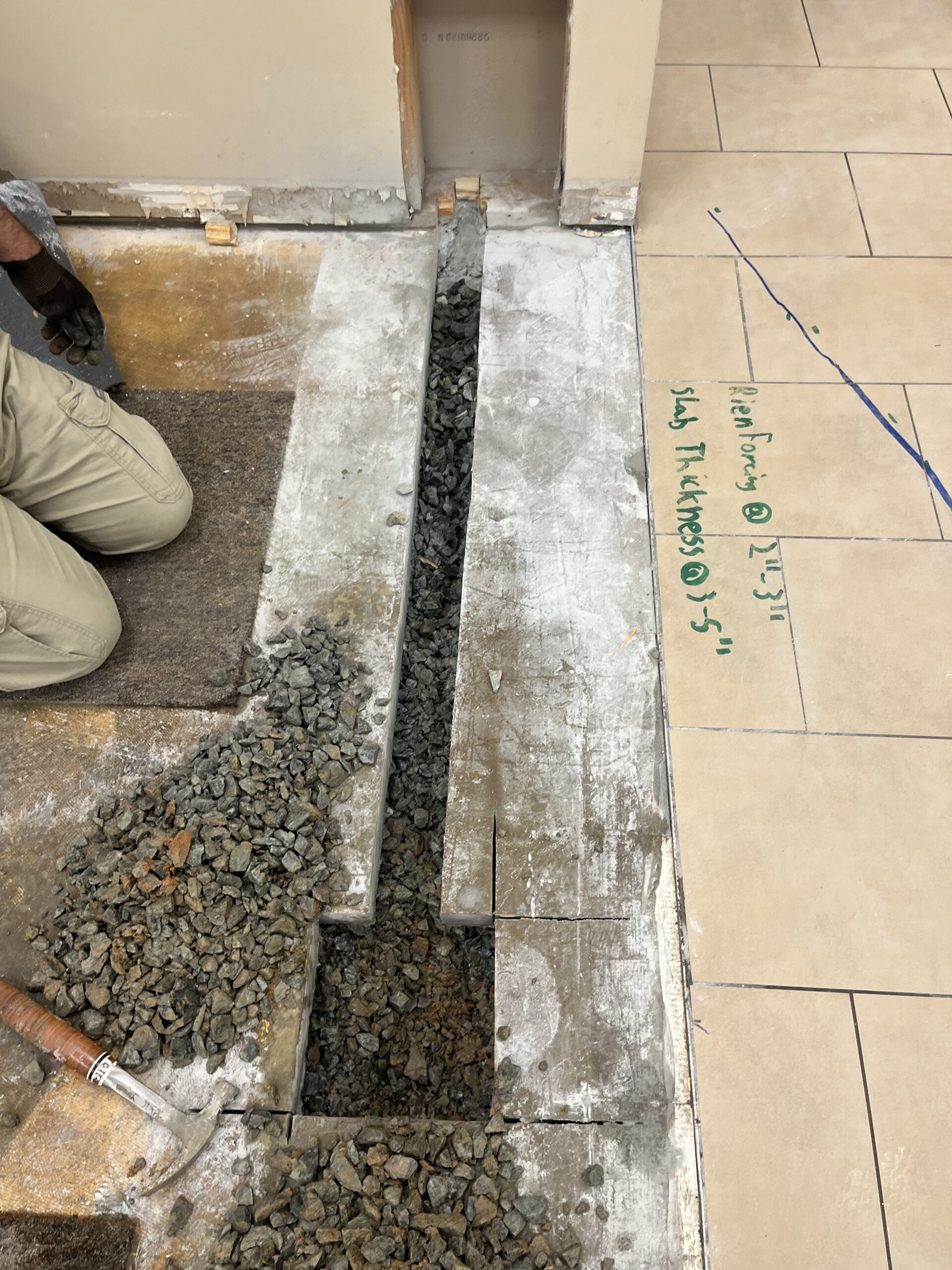 ScanCore team trenching concrete for underground electrical line installation